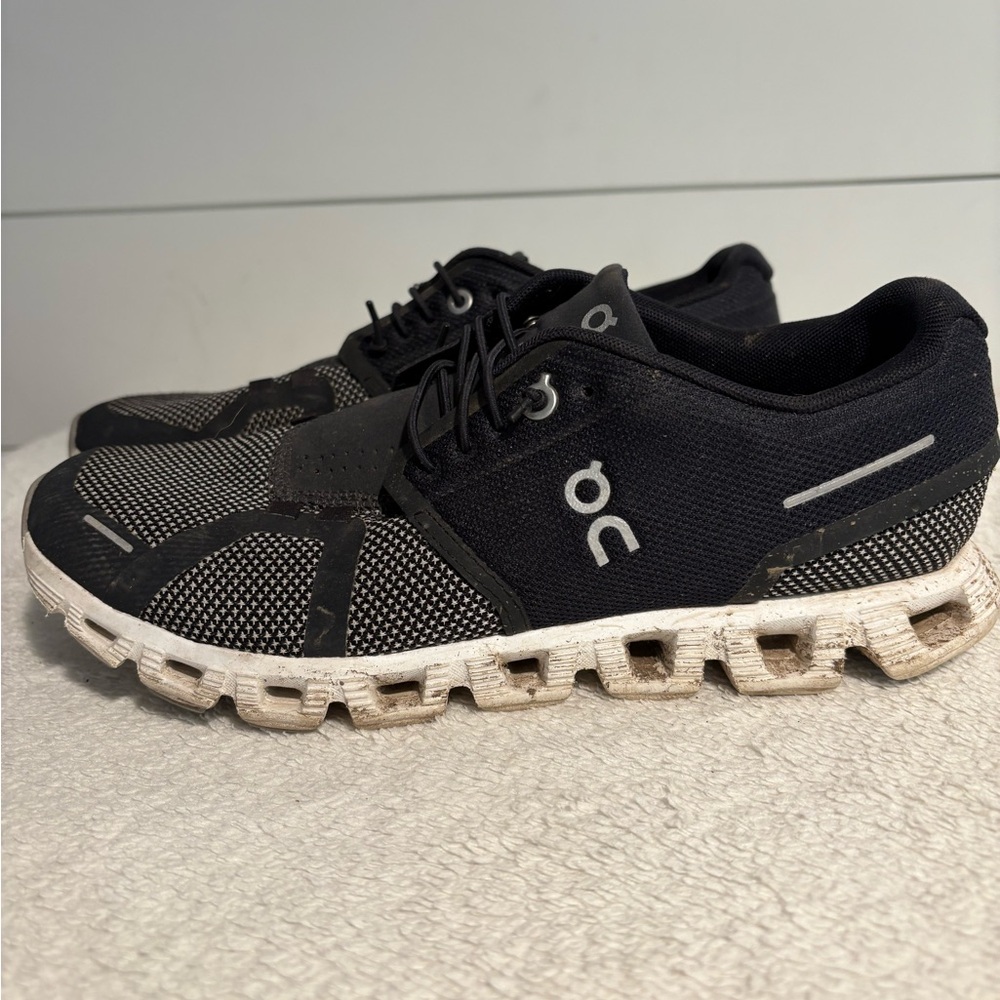 On Running Black and White Athletic Shoes with Cloud Cushioning